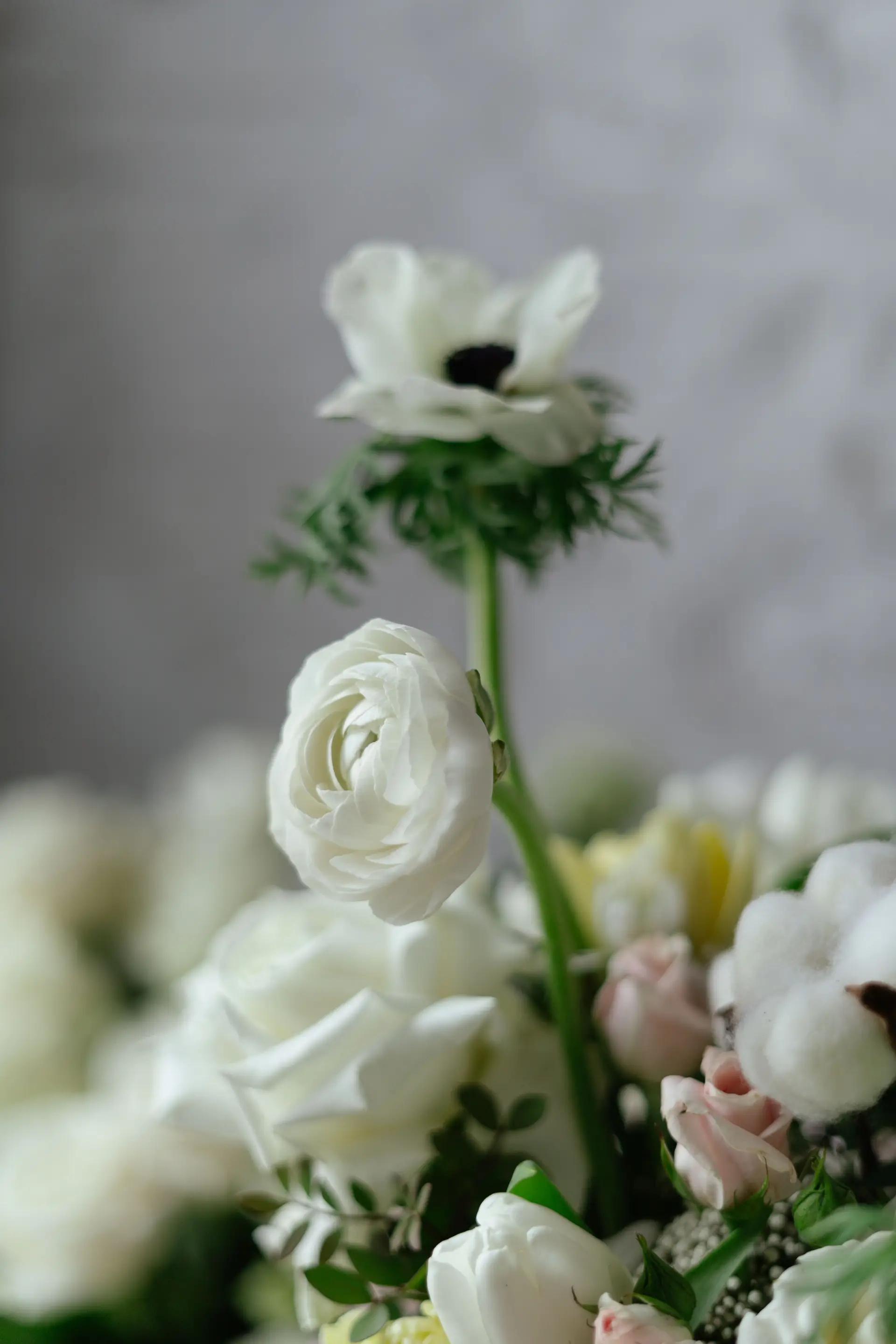 Elegant white floral bouquet with roses and anemones