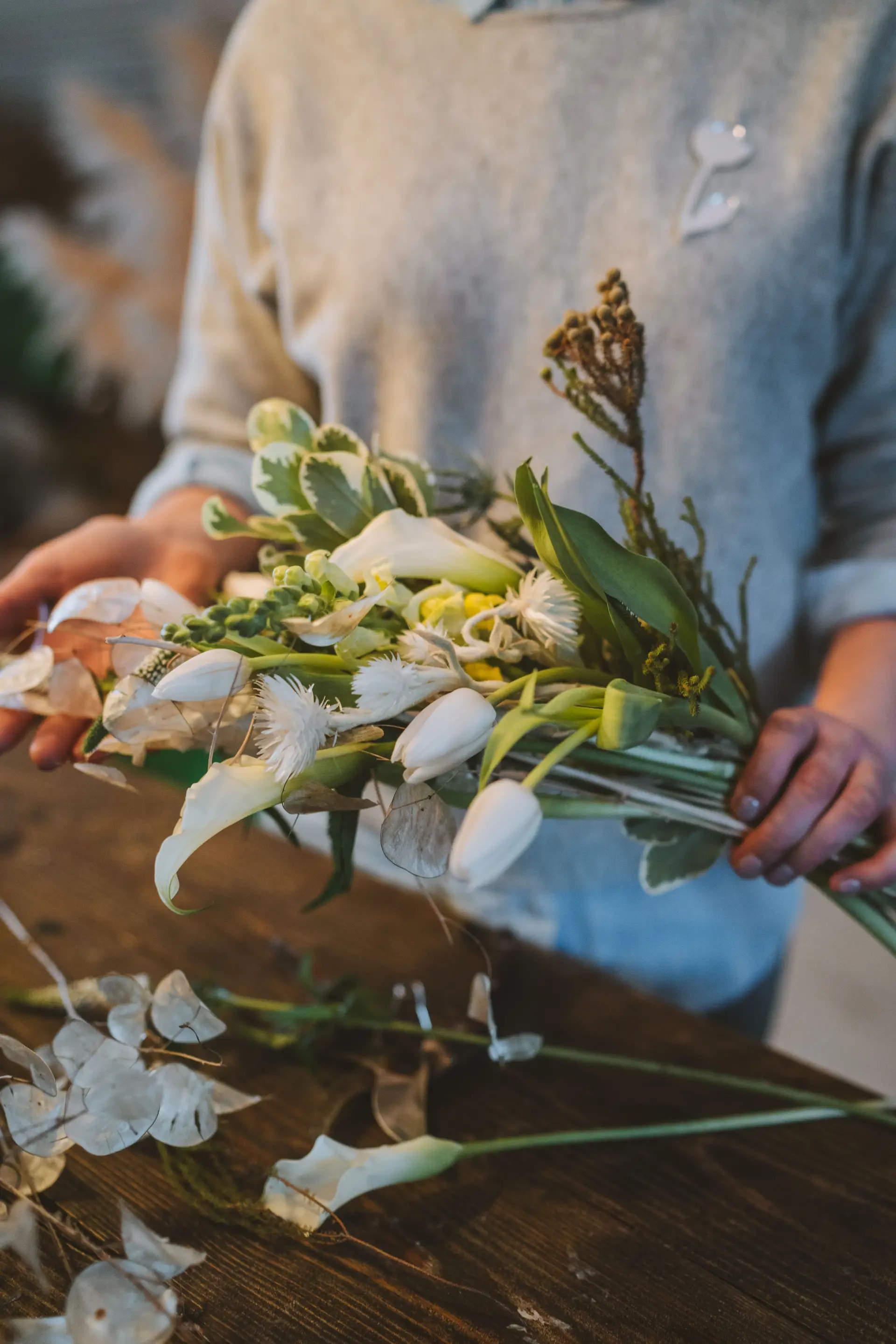 Delicate floral design in progress on studio table